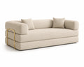 Divano in tessuto beige con dettagli metallici dorati